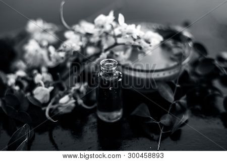 Herbal And Floral Essence Or Concentration Of Drumstick Flowers Along With Its Paste On Wooden Surfa