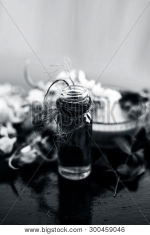 Herbal And Floral Essence Or Concentration Of Drumstick Flowers Along With Its Paste On Wooden Surfa