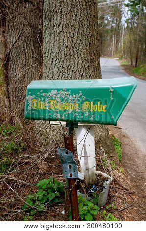 Rowley, Massachusetts, April 28, 2019: The Green Mailbox Collects The Daily Newspaper The Globe,  An