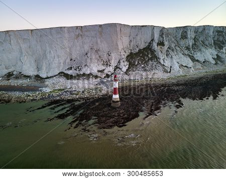 Aerial Drone Landscape Image Of Lighthouse And Chalk Cliffs At Sunrise In England