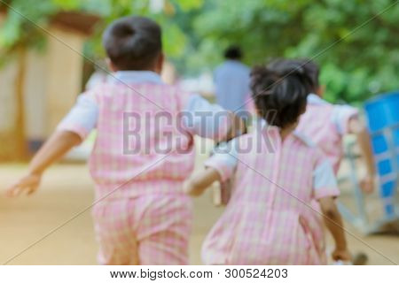 Blur Image Of Kindergarten Students Run Back To The Classroom After Having Lunch.