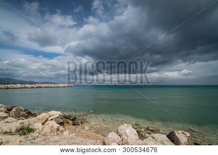 Stormy Dramatic Clouds Accumulating Over Alykes Beach In Zante Island, Greece