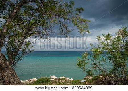 Stormy Dramatic Clouds Accumulating Over Alykes Beach In Zante Island, Greece