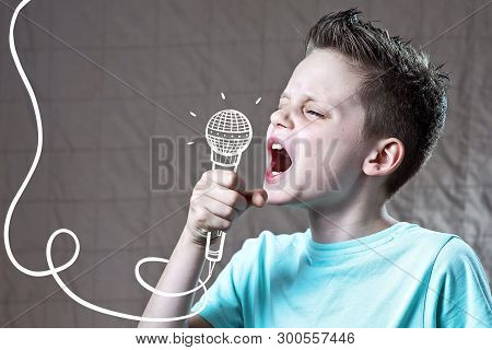 A Boy In A Blue T-shirt Sings Very Loudly Into A Painted Microphone