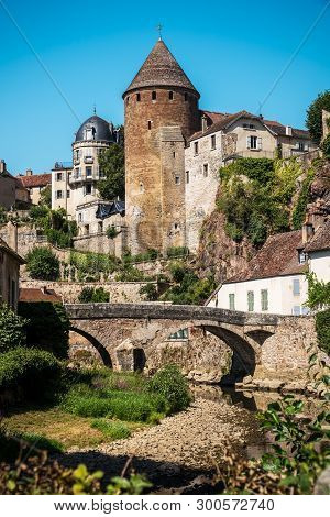 View From The Docks Of The Vaulted Bridge And The Old Medieval Town Of Semur En Auxois In France