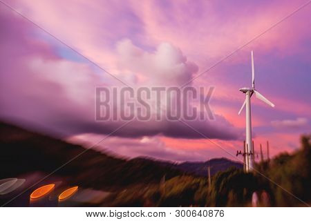 Gorgeous Sunset On Kata Beach View Point. Electric Wind Turbine On Pink Cloudscape Background. Phuke