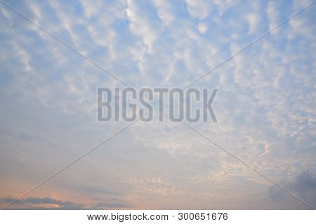 Background Of Stratocumulus Clouds On Blue Sky During Sunrise
