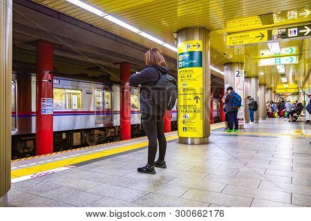 Tokyo, Japan - 24 April 2019 - Commuters Wait For The Subway Train At A Subway Station In Tokyo, Jap