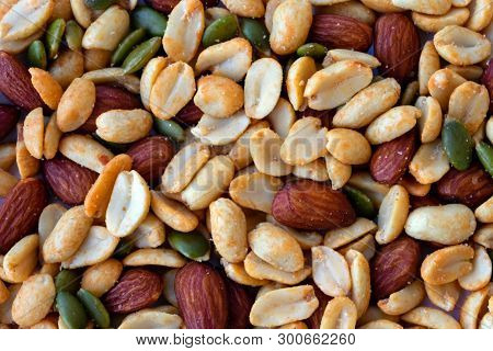 Background Made Of Peanuts, Almond, Pumpkin Seeds Top View