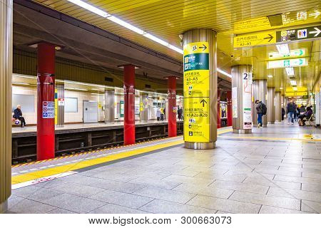 Tokyo, Japan - 24 April 2019 - Commuters Wait For The Subway Train At A Subway Station In Tokyo, Jap
