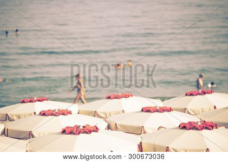 White Umbrells On The Beach - Toned Image