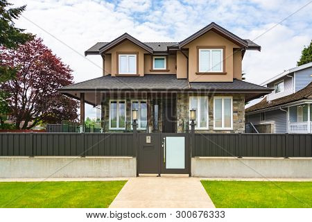 Brand New Luxury Residential House For Sale. Big Family House With Concrete Pathway And Metal  Fence