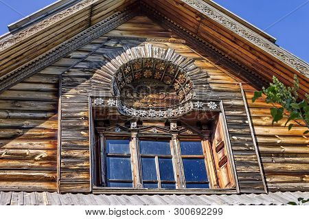 Log Hut Facade. Woodcarving. Russian Village. Old Wooden Houses - Monument Of Ancient Wooden Archite