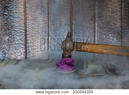 Plastic Trash And Human. Hammer Smashing A Plastic Cup As The Concept Of Failure From Plastic.