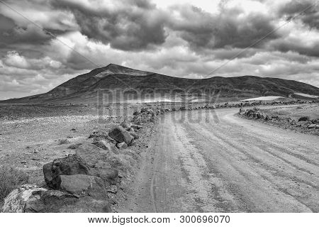 On The Road To Papagayo Beach With View To The Volcanic Mountain Hacha Grande On A Cloudy Day, Black