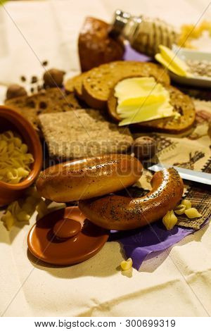 Whole Grain Bread Put On Kitchen Wood Plate. Fresh Bread On Table Close-up. Fresh Bread On The Kitch