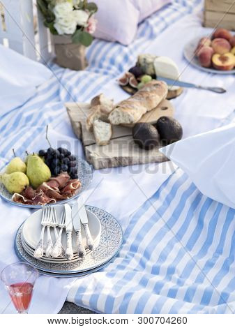 Summer Brunch Or Dinner Organized On A Sea Shore For Friends. Elegant Decorated Place For Romantic D