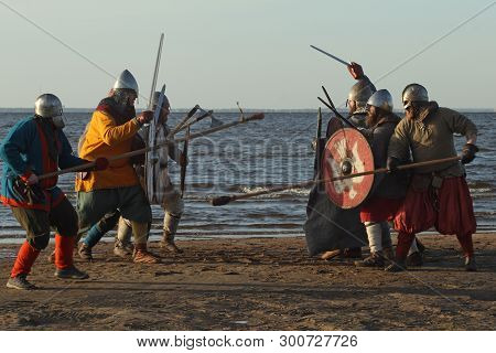 Slavic Warriors Reenactors With Wearpons And Shields Training Fighting Outdoors At Seaside