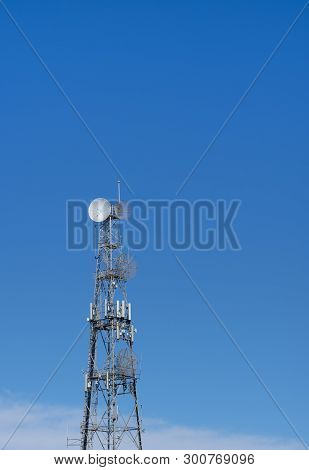 Communication Tower Against A Clear Blue Sky