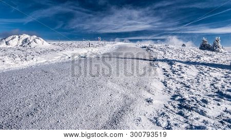 Winter Hiking Trail Covered By Snow With Small Trees And Blue Sky With Clouds Near Pretulalpe Hill I