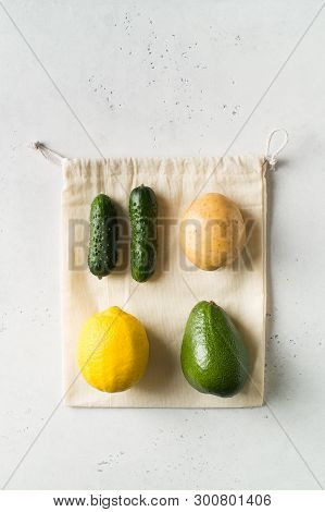 Zero Waste Concept. Textile Ecologiical Shopping Bags With Fruits And Vegetables On White Background