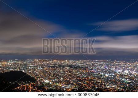 Night Cityscape View Of Sapporo City From Mountain Moiwa Observation. The Most Popular Tourist Desti