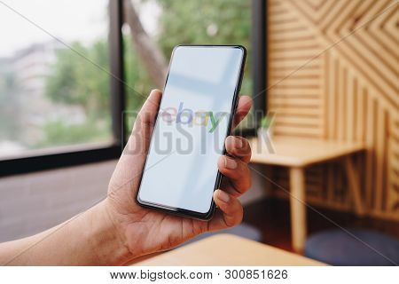 Chiang Mai, Thailand - Mar. 23,2019: Man Holding Xiaomi Mi Mix 3 With Ebay Apps On The Screen. Ebay 