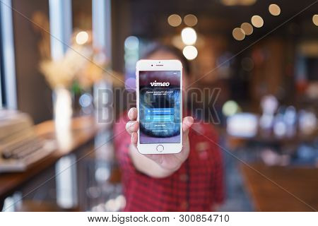 Chiang Mai, Thailand - Apr.08,2019: Woman Holding Apple Iphone 6s Rose Gold With Vimeo On Screen.  V