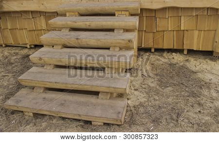 The Wooden Staircase On The Porch Of The Hut
