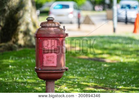 Vintage Dog Waste Bin In The Park For Responsible Owners To Dispose Of Their Dogs Toilet