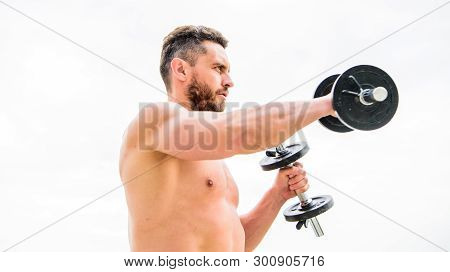 Sporty Handsome. Success. Perfect Biceps. Athletic Body. Dumbbell Gym. Fitness And Sport Equipment. 