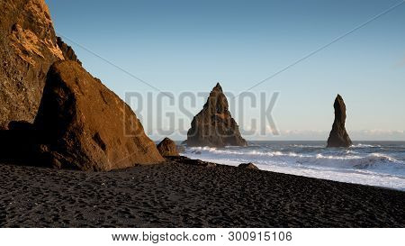 Panoramic Image Of The Rock Spires Of Reynisdrangur At Sunset, Coast Of Reynisfjara Close To Vik, Ic