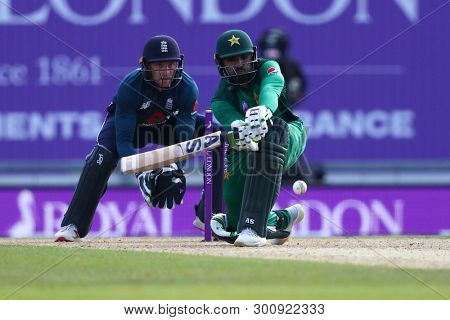 SOUTHAMPTON, ENGLAND. MAY 11 2019: Asif Ali of Pakistan plays a shot as wicketkeeper Joss Buttler of England looks on during the England v Pakistan, 2nd ODI