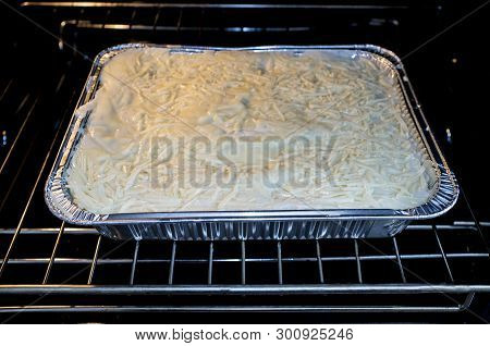 Pre-cooked Cold Lasagne Foil Tray. Displayed In Oven Ready To Be Grated
