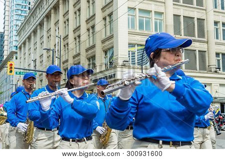 May 12, 2019 - Vancouver, Canada: Falun Dafa Members In Parade Through Streets Of Downtown On Mother