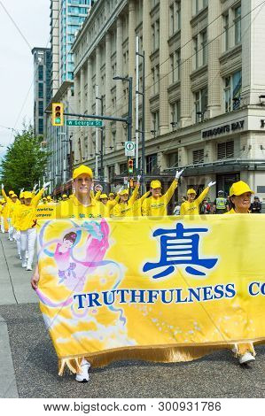 May 12, 2019 - Vancouver, Canada: Falun Dafa Members In Parade Through Streets Of Downtown On Mother
