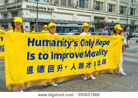 May 12, 2019 - Vancouver, Canada: Falun Dafa Members In Parade Through Streets Of Downtown On Mother