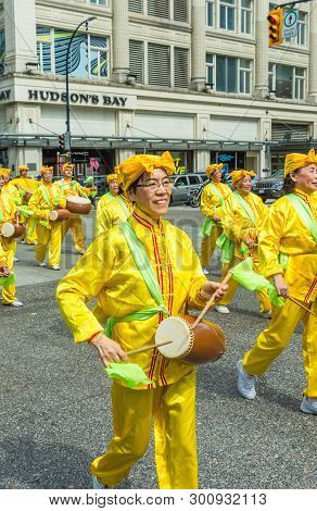 May 12, 2019 - Vancouver, Canada: Falun Dafa Members In Parade Through Streets Of Downtown On Mother