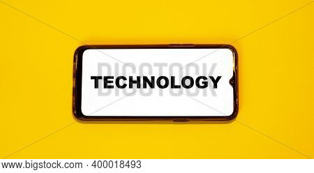 Technology Word On White Screen Of 2021 Smartphone.