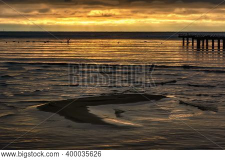 A Sand Bar With A Beautiful Ocean Sunset In The Background. Photo From Hallevik, Blekinge County, Sw