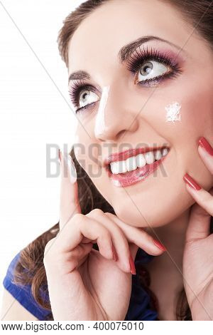 Young Female Concepts. Portrait Of Young Caucasian Brunette Woman Using Facial Cream And Posing Agai