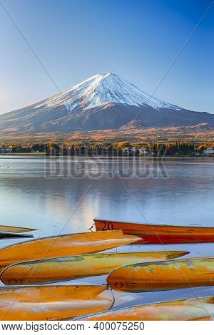 Fuji Mountain Near Lake Kawaguchiko In Japan With Line Of Overthrown Boats