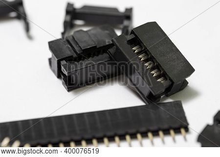Macro Shot Of Long Straight Pcb Connectors Or Terminal Blocks Placed Bulk On White Background.