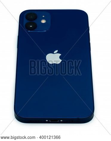 Ostfildern - Germany, December 5, 2020: Back Of The Apple Iphone 12 In Blue Colour With Slight Shado