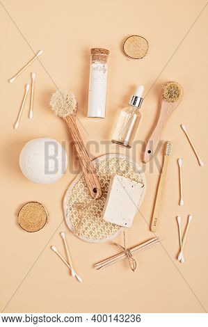 Eco Friendly Soap Bar, Tooth Brushes, Cotton Swabs, Bath Salt, Clay Mask And Washcloth On Neutral Ba