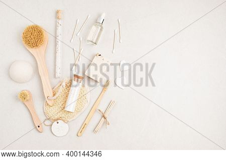 Eco Friendly Soap Bar, Tooth Brushes, Cotton Swabs, Bath Salt, Clay Mask And Washcloth On Neutral Ba