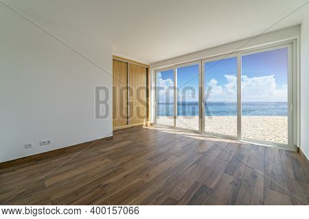 Empty Room With Dark Wooden Floating Laminate Flooring. House Interior, Wide Bedroom Or Living Room 