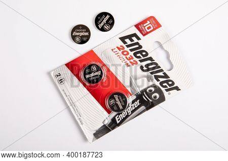 Energizer 2032 Lithium Coin Battery. Cardboard And Plastic Packaging. White Background