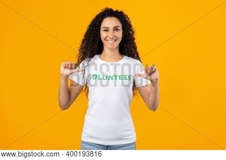 Im A Volunteer. Happy Woman Activist Pointing At Herself And Volunteer Inscription On Her T-shirt St