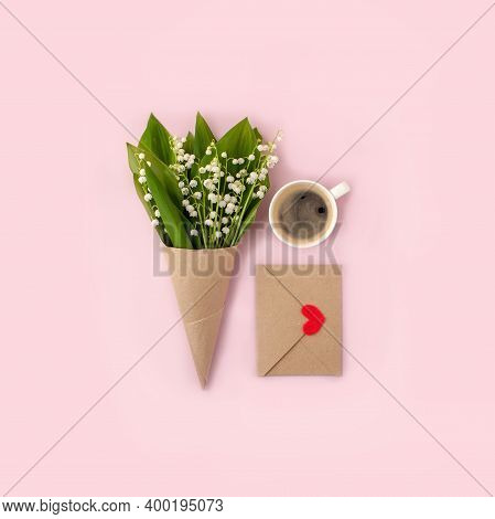 Bouquet Of Flowers And Cup Of Coffee And Mock Up Fpr Letter Message On Pink, Copy Space, Minimal Gre